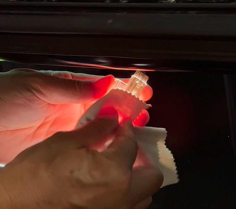 removing hot stock halogen bulb with a cloth